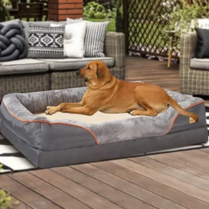 Orthopedic dog bed in dark grey, showing the overall shape and bolster.