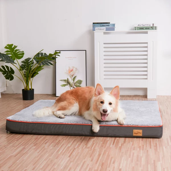 A dog resting comfortably on a large grey orthopedic dog bed