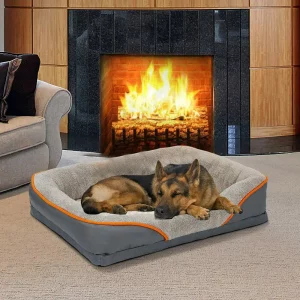 Orthopedic pet bed in grey, showing the overall sofa-like design with plush bolster.