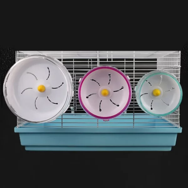 Hamster wheel attached to a cage side, showing the secure buckle mechanism