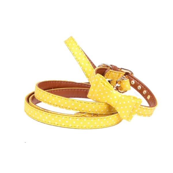 Dog leash made of PU leather with dot pattern, held for display.