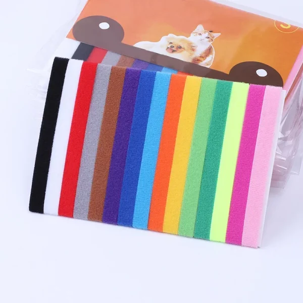 Set of 12 multicolour puppy identification collars laid out