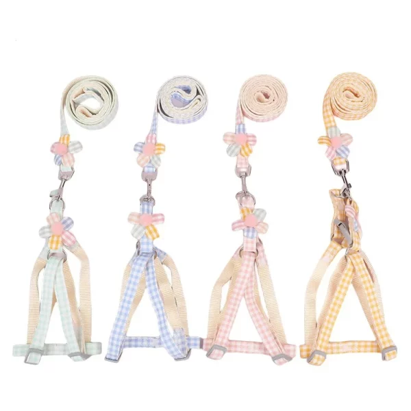 The complete small dog harness and leash set laid out, showing the plaid design.