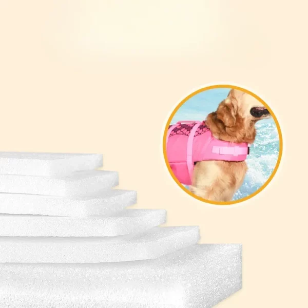 Dog wearing red mermaid life jacket, on a boat