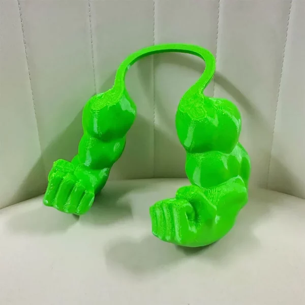 Playful cat posing with its 3D printed muscle arm cosplay accessory