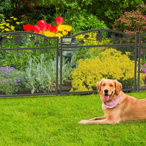 Dog playpen configured in an L-shape in a garden setting, showing its versatility.