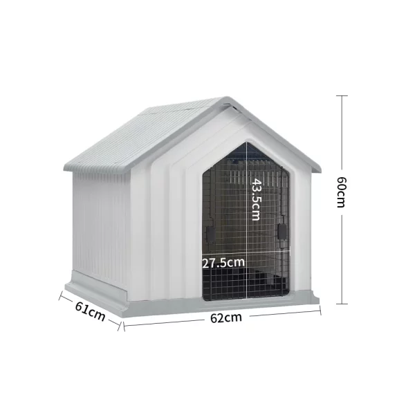 White dog kennel placed in an outdoor garden setting.