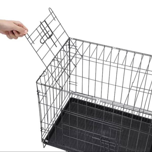 Wire dog crate with the removable plastic tray pulled out for easy cleaning