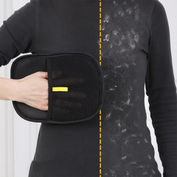 Pet hair remover mitt being used on a dog's back