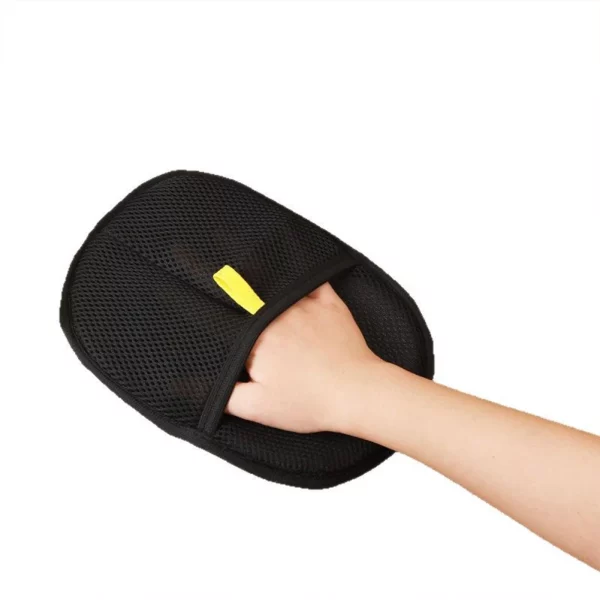 Pet hair remover mitt on a hand, showing the comfortable cuff design