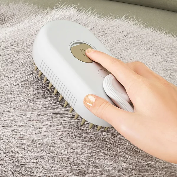 3-in-1 cat steam brush in use, gently grooming a pet with visible steam mist
