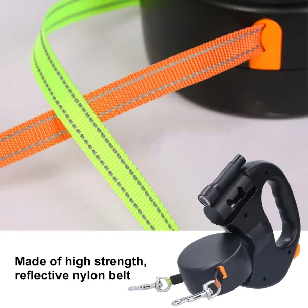 Two dogs being walked simultaneously with the retractable double leash.