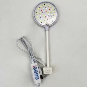 USB clip on aquarium light attached to a small fish tank, showing the light illuminating the water.