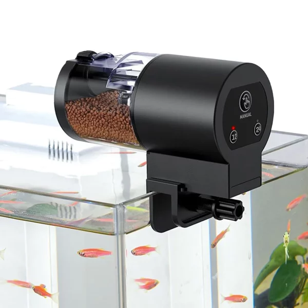 Side view of the automatic fish feeder mounted on the glass of a fish tank