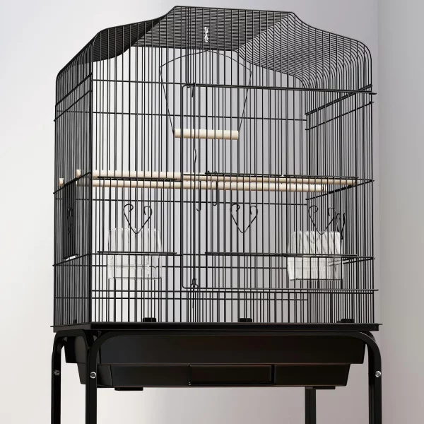 Front view of the bird cage showing the large access door and wooden perch inside.