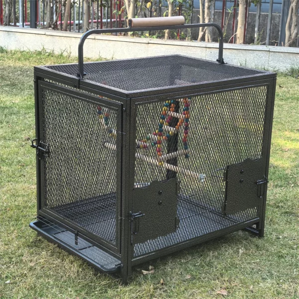 Close-up of the sturdy wooden handle on top of the bird cage