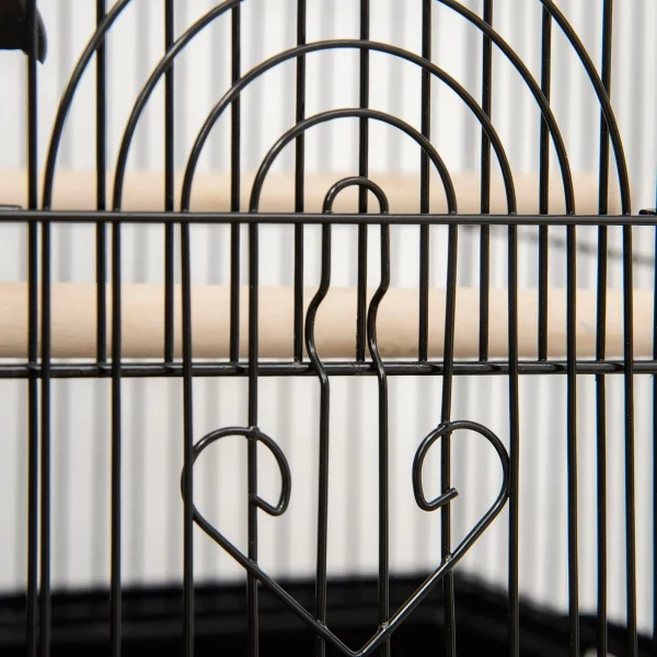 Side view of the bird cage, highlighting its spacious interior and roof-shaped design.