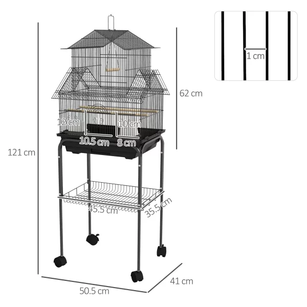 Close-up of the bird cage door, showing the latch mechanism and perch placement.
