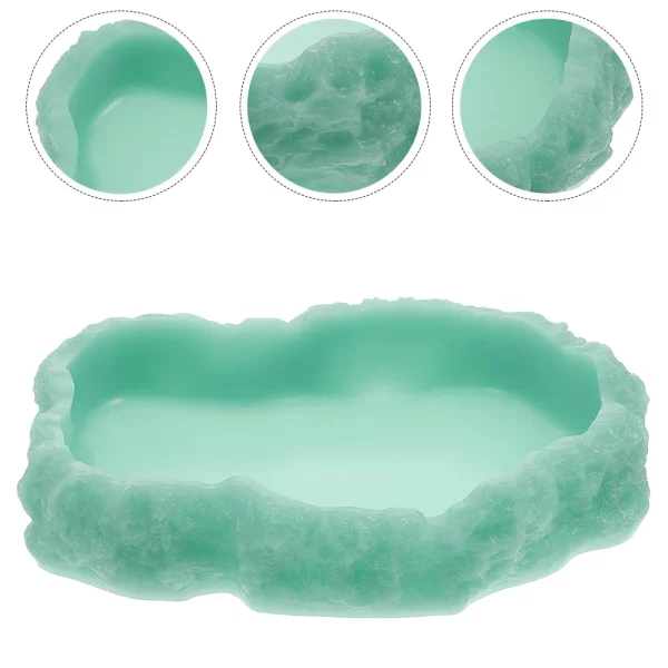 Close-up of the light green reptile feeding bowl from the front