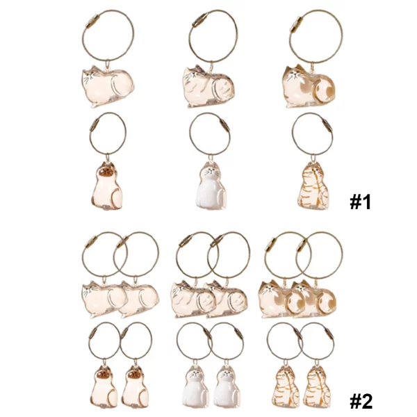 Set of cat fur keepsake keychains, showcasing different capsule designs.