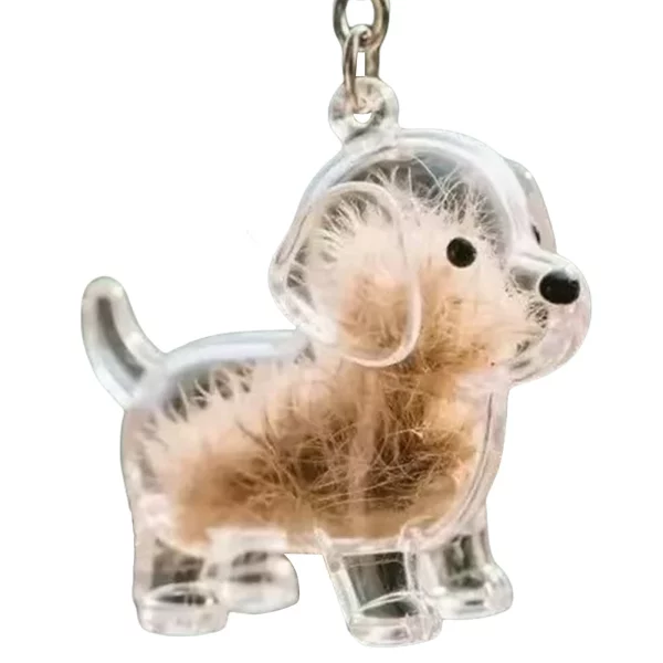 Dog hair collector keychain attached to a set of keys for portability