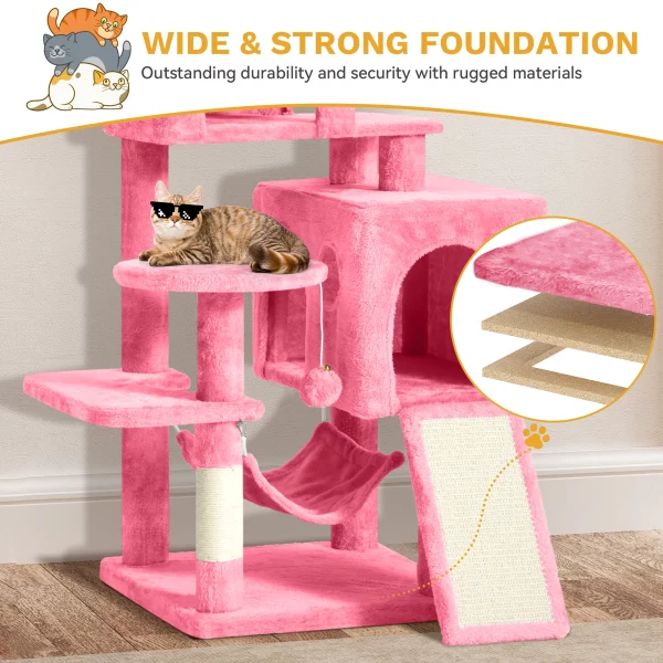 A cat comfortably resting inside one of the enclosed caves on the pink cat tree