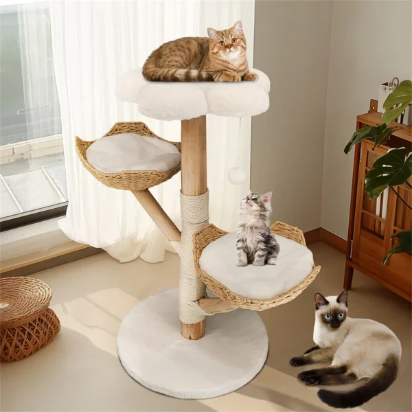 Cat playing with the dangling toy attached to the cat tree