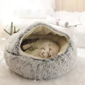 Plush pet cat bed in a round cave design, showing soft interior.