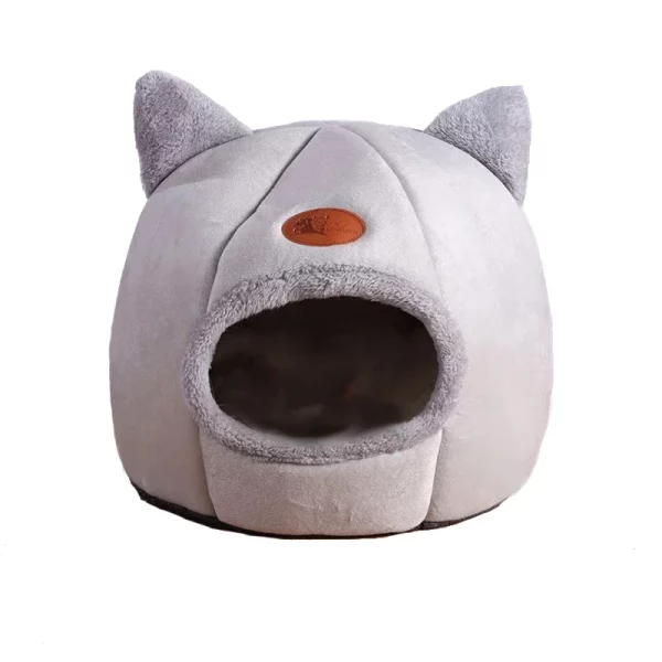 Cat comfortably resting inside the cozy winter cat bed