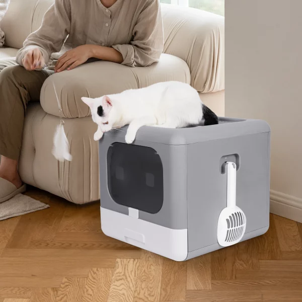 Enclosed cat toilet house, grey and white, showing top entry