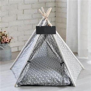 Front view of a pet tent house dog bed with a dog resting inside