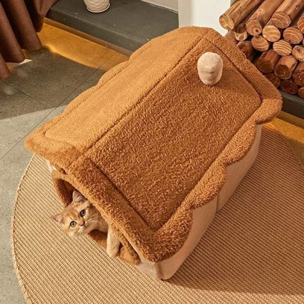 Interior view of the pet house, highlighting the soft lining and the plush, double-sided cushion.