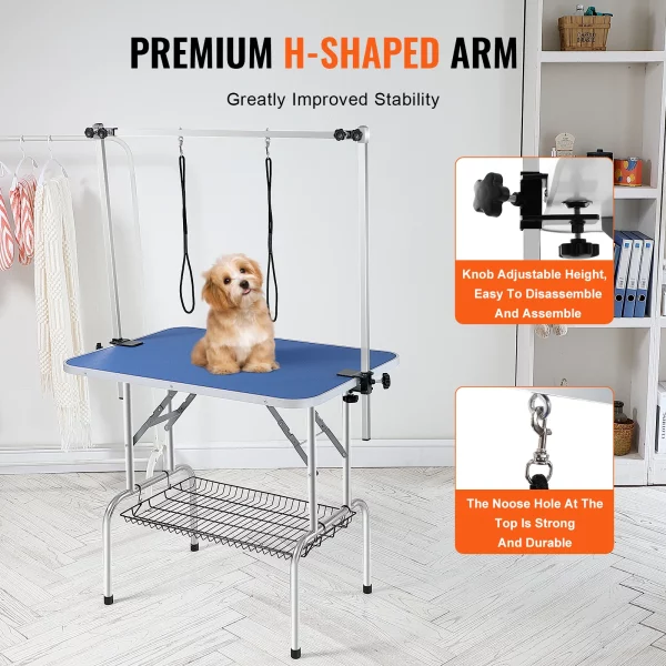 Pet grooming table with dog secured by leash loop on adjustable H-arm