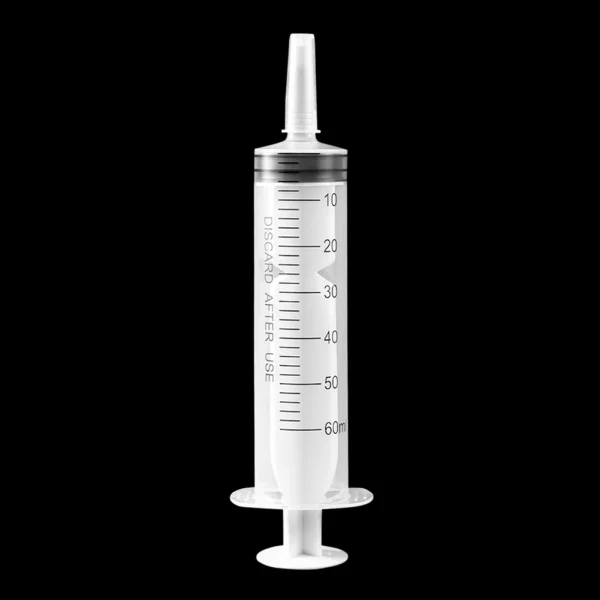 Syringe in use, dispensing a clear liquid accurately