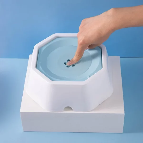 Dog drinking from the anti-splash water bowl, illustrating slow-flow