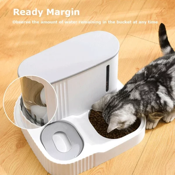 Close-up of the water dispenser mechanism on the automatic pet feeder, demonstrating the siphon refill system.
