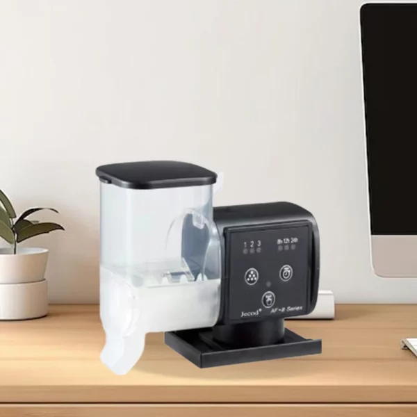 Close-up of the automatic fish feeder's food dispensing mechanism