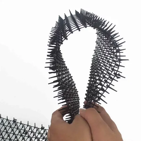 Close-up of the spike pattern on a garden cat repellent mat