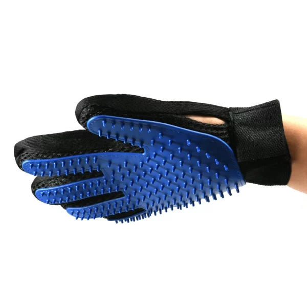 Red pet grooming glove, showing adjustable Velcro strap