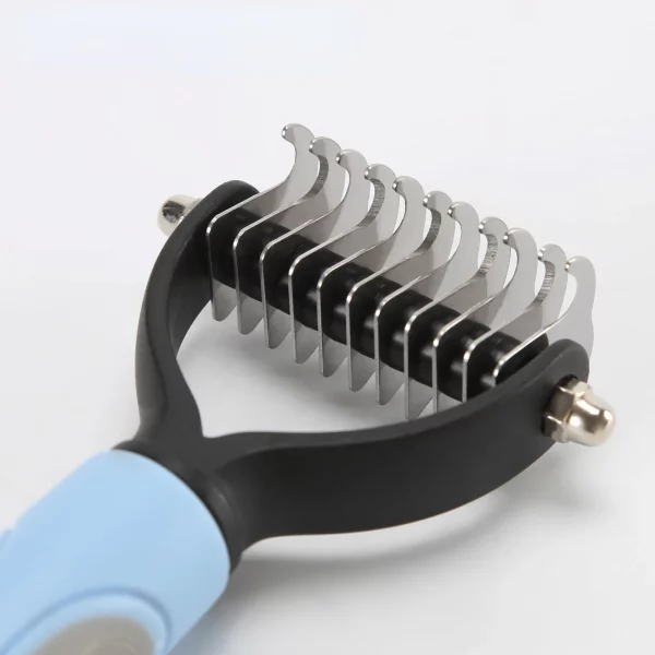 Dog grooming brush, side view showing ergonomic handle, pink colour option