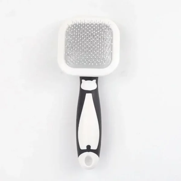 Pet owner using the self-cleaning slicker brush on a dog's coat.