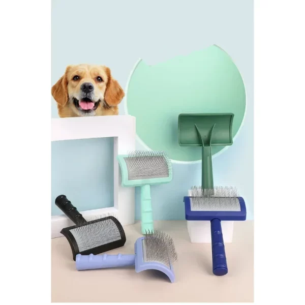 Ergonomic handle of the pet grooming brush, designed for a comfortable grip.