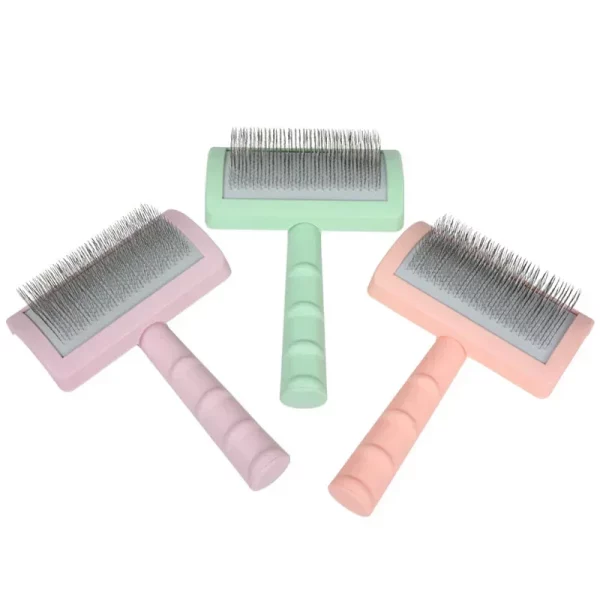 Close-up of the pet grooming brush head showing the fine steel needles.